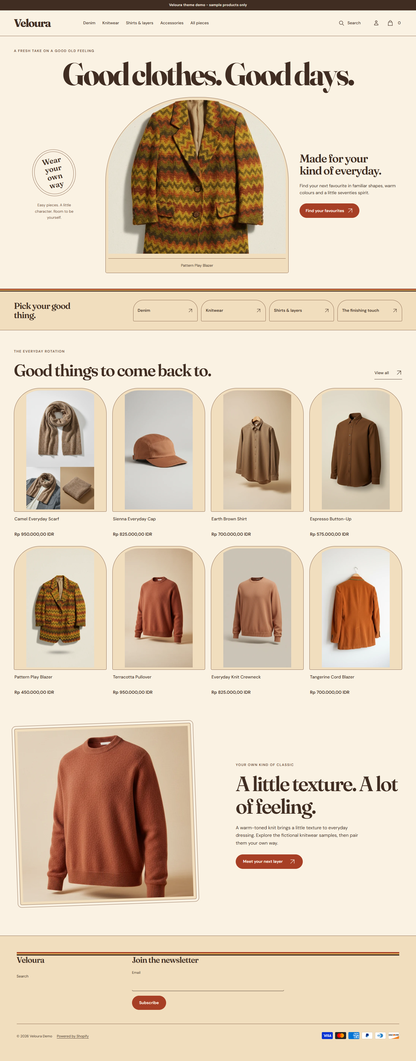 Actual Veloura desktop homepage with arched cover, wardrobe routes and warm product frames.